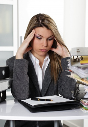 woman doing taxes, getting stressed